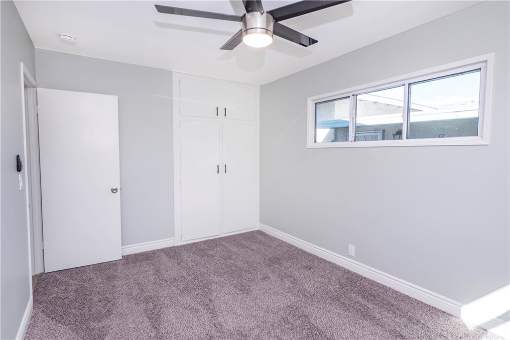 150 East Gladstone Street San Dimas, CA 91773 - Photo 27 of 37 a view of an empty room with window and chandelier fan
