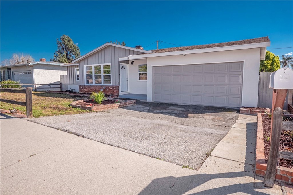 150 East Gladstone Street San Dimas, CA 91773 - Photo 4 of 37 a front view of a house with garden