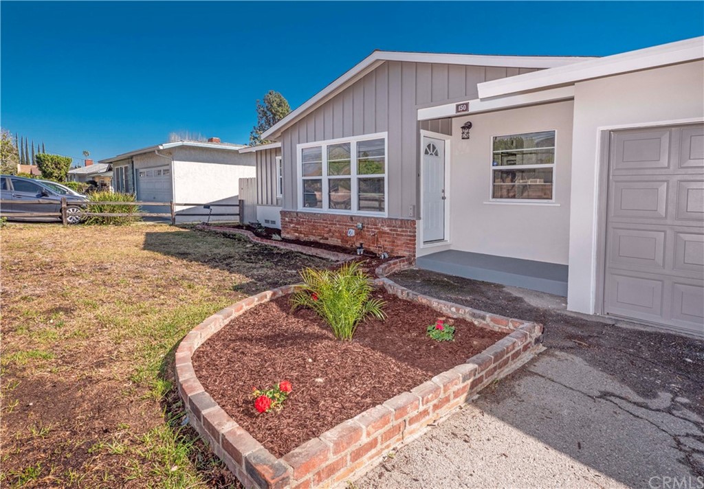 150 East Gladstone Street San Dimas, CA 91773 - Photo 5 of 37 a front view of a house with garden