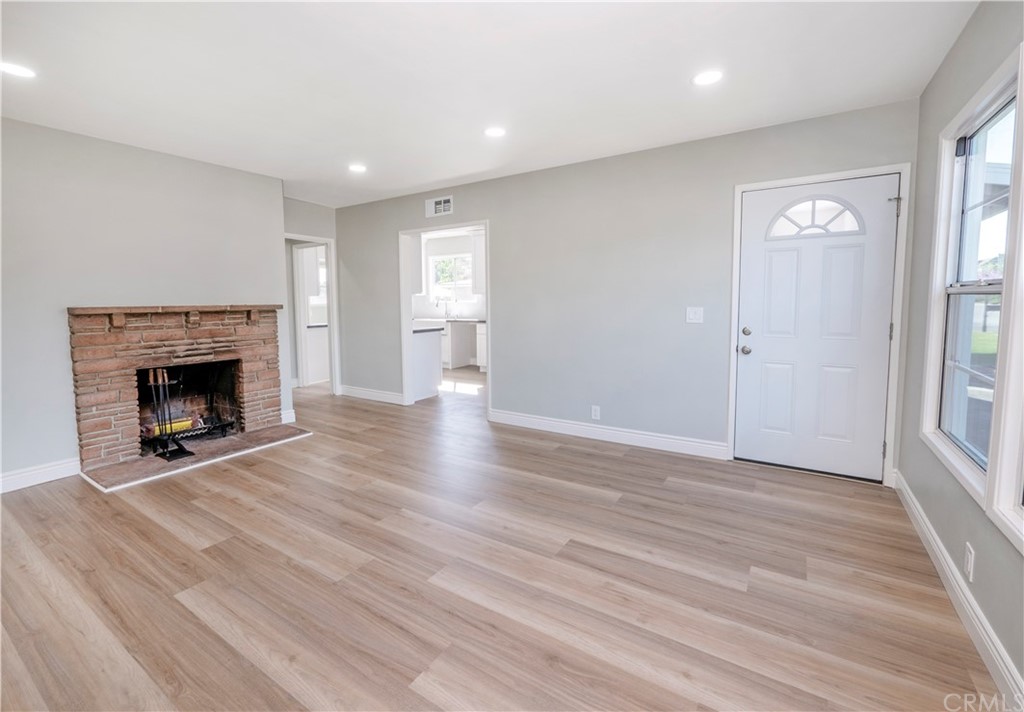 150 East Gladstone Street San Dimas, CA 91773 - Photo 8 of 37 wooden floor fireplace and windows in an empty room