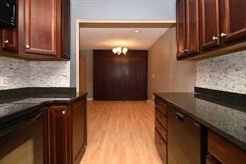 30 Juniper Road, Unit 34 North Attleboro, MA 02760 - Photo 2 of 8 a kitchen with granite countertop a sink a stove and cabinets