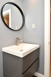 30 Juniper Road, Unit 34 North Attleboro, MA 02760 - Photo 7 of 8 a bathroom with a sink a mirror and a
