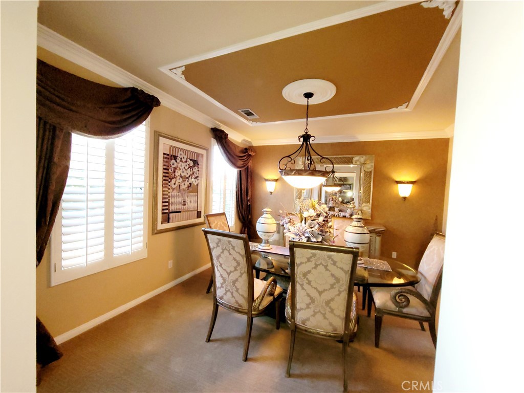 14119 Ashton Lane Riverside, CA 92508 - Photo 15 of 47 a view of a dining room with furniture and window
