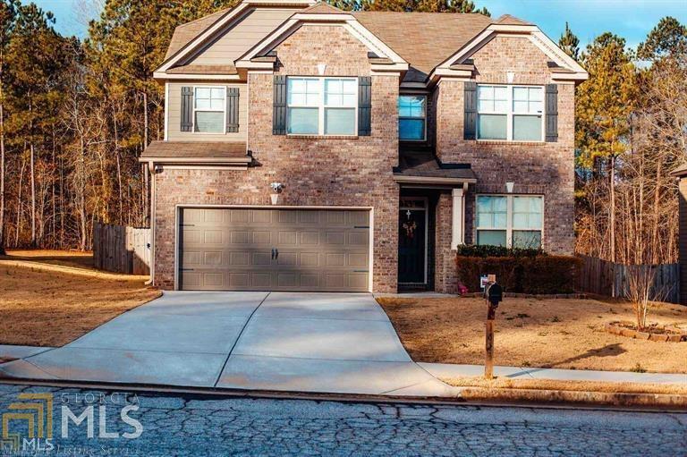 1413 Stone Ridge Court Hampton, GA 30228 - Photo 1 of 1 a front view of a house with garden