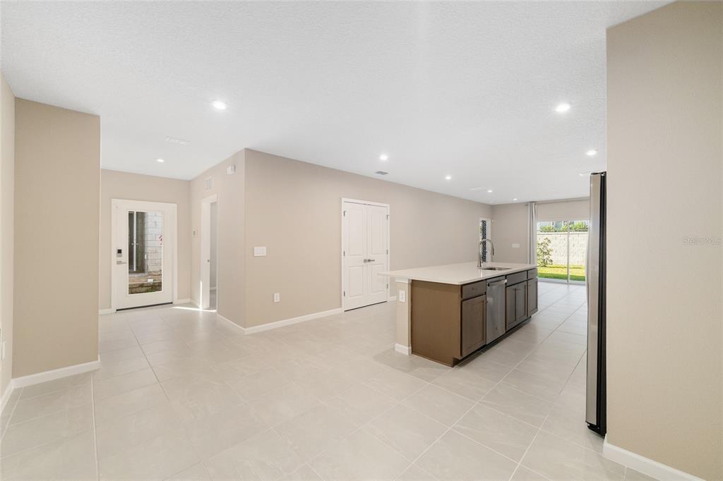 1183 Turtle Is Road Lady Lake, FL 32159 - Photo 14 of 39 a view of an empty room with kitchen and a window