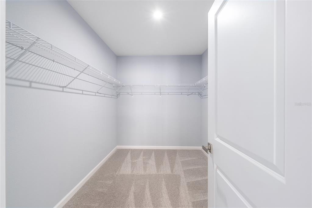 1183 Turtle Is Road Lady Lake, FL 32159 - Photo 23 of 39 a view of a room with racks on the wall