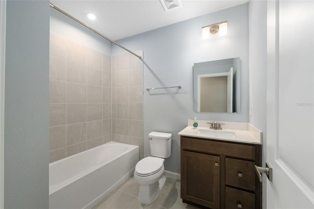 1183 Turtle Is Road Lady Lake, FL 32159 - Photo 28 of 39 a bathroom with a toilet a sink and bathtub