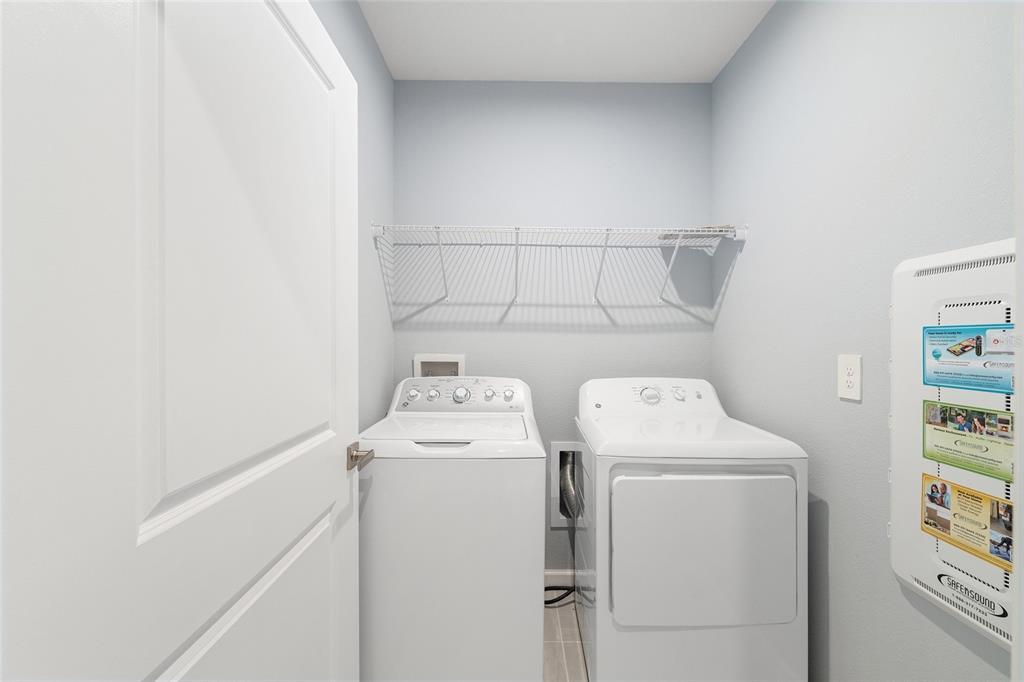 1183 Turtle Is Road Lady Lake, FL 32159 - Photo 32 of 39 a utility room with dryer and washer