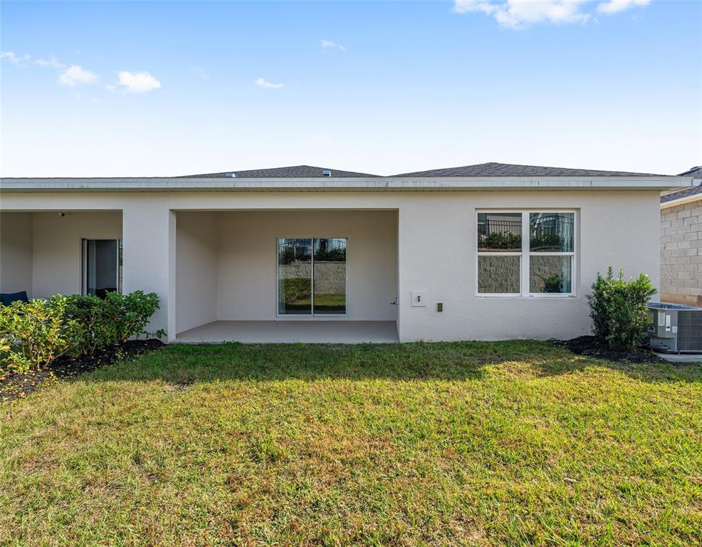 1183 Turtle Is Road Lady Lake, FL 32159 - Photo 38 of 39 a view of a house with backyard and garden