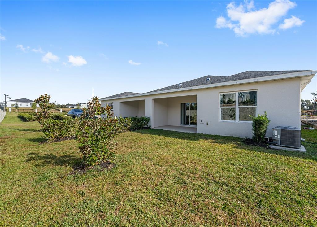 1183 Turtle Is Road Lady Lake, FL 32159 - Photo 39 of 39 a view of a house with a backyard