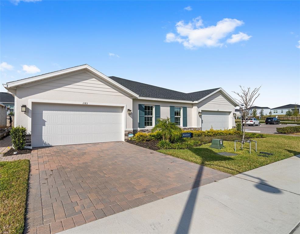 1183 Turtle Is Road Lady Lake, FL 32159 - Photo 5 of 39 a view of a house with a yard and potted plants