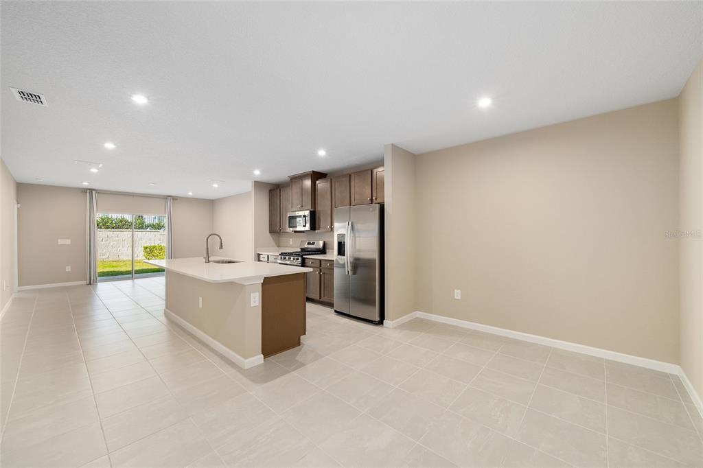 1183 Turtle Is Road Lady Lake, FL 32159 - Photo 10 of 39 a view of kitchen with cabinets and stainless steel appliances