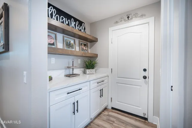 a kitchen with a sink and cabinets