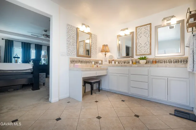 a room with a sink and a mirror