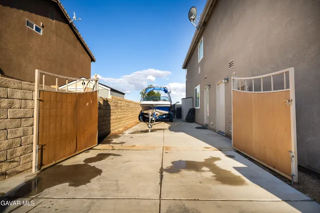a view of a house with a yard porch and furniture