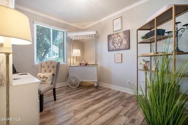 a workspace with furniture and window