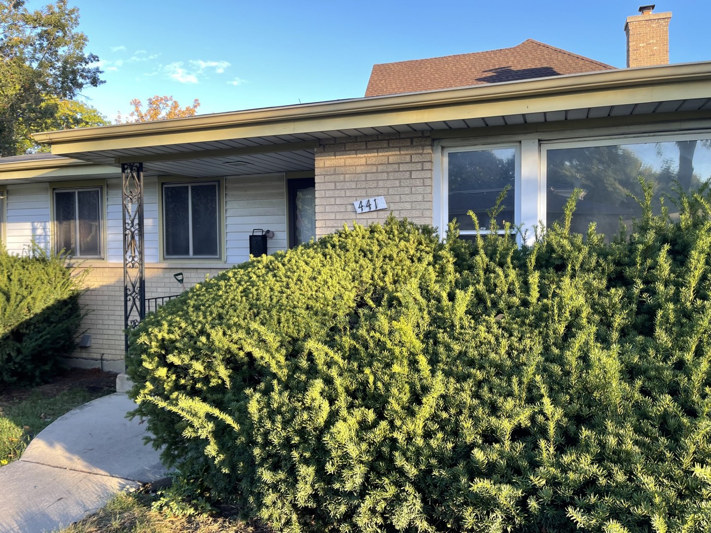 front view of a house with a small yard