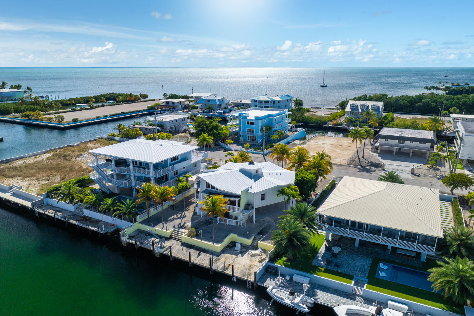 184 Bahama Avenue Key Largo, FL 33037 - Photo 2 of 72 an aerial view of a house with a garden and lake view