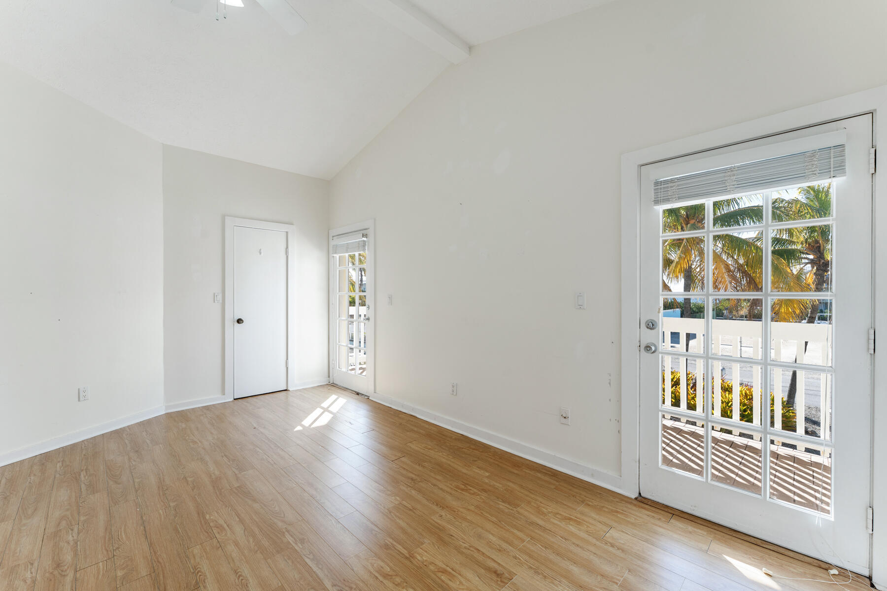 184 Bahama Avenue Key Largo, FL 33037 - Photo 35 of 72 a view of an empty room with wooden floor and a window