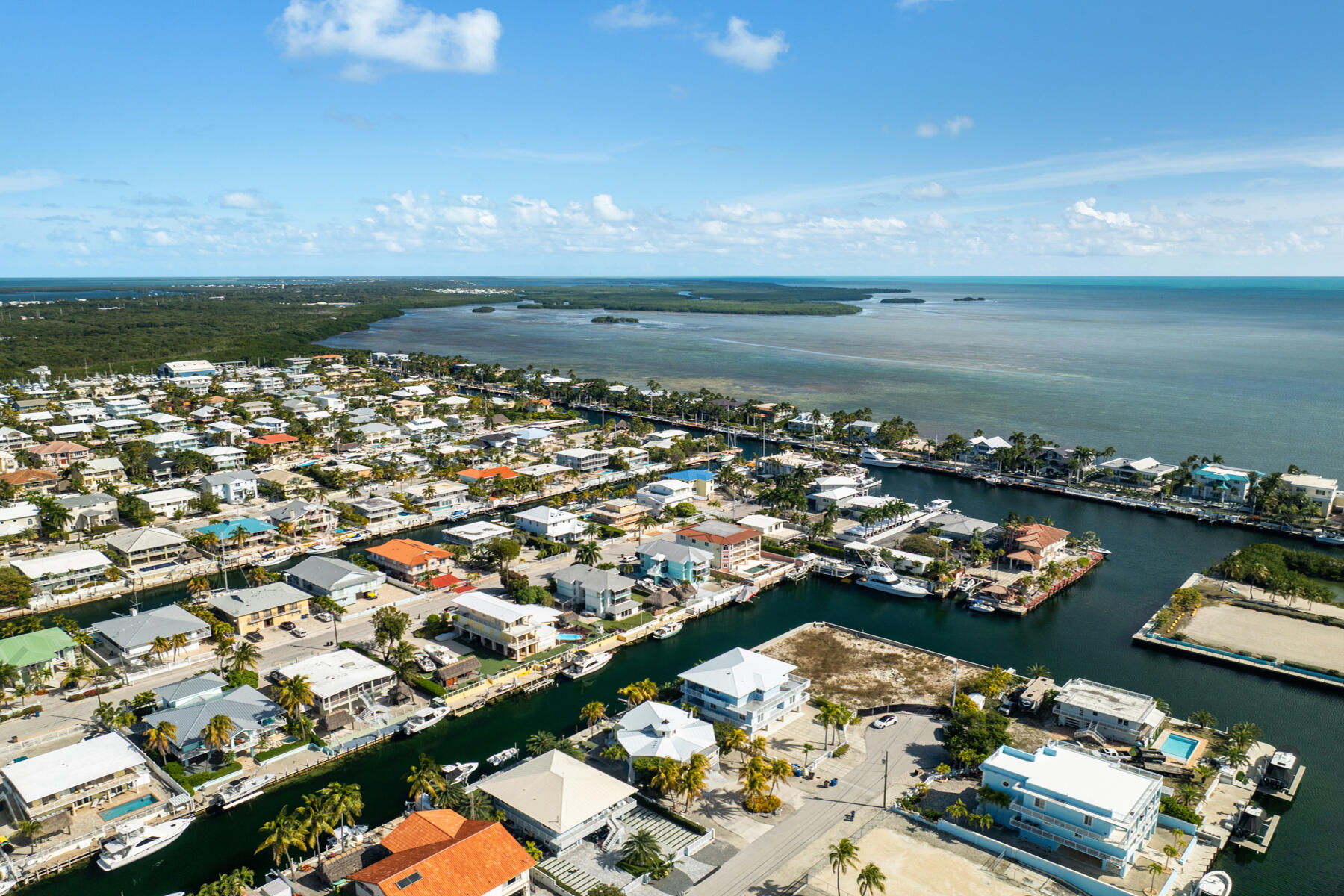 184 Bahama Avenue Key Largo, FL 33037 - Photo 62 of 72 an aerial view of a city with lots of residential buildings ocean and mountain view in back