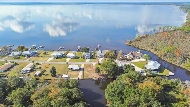 a view of lake with lawn chairs