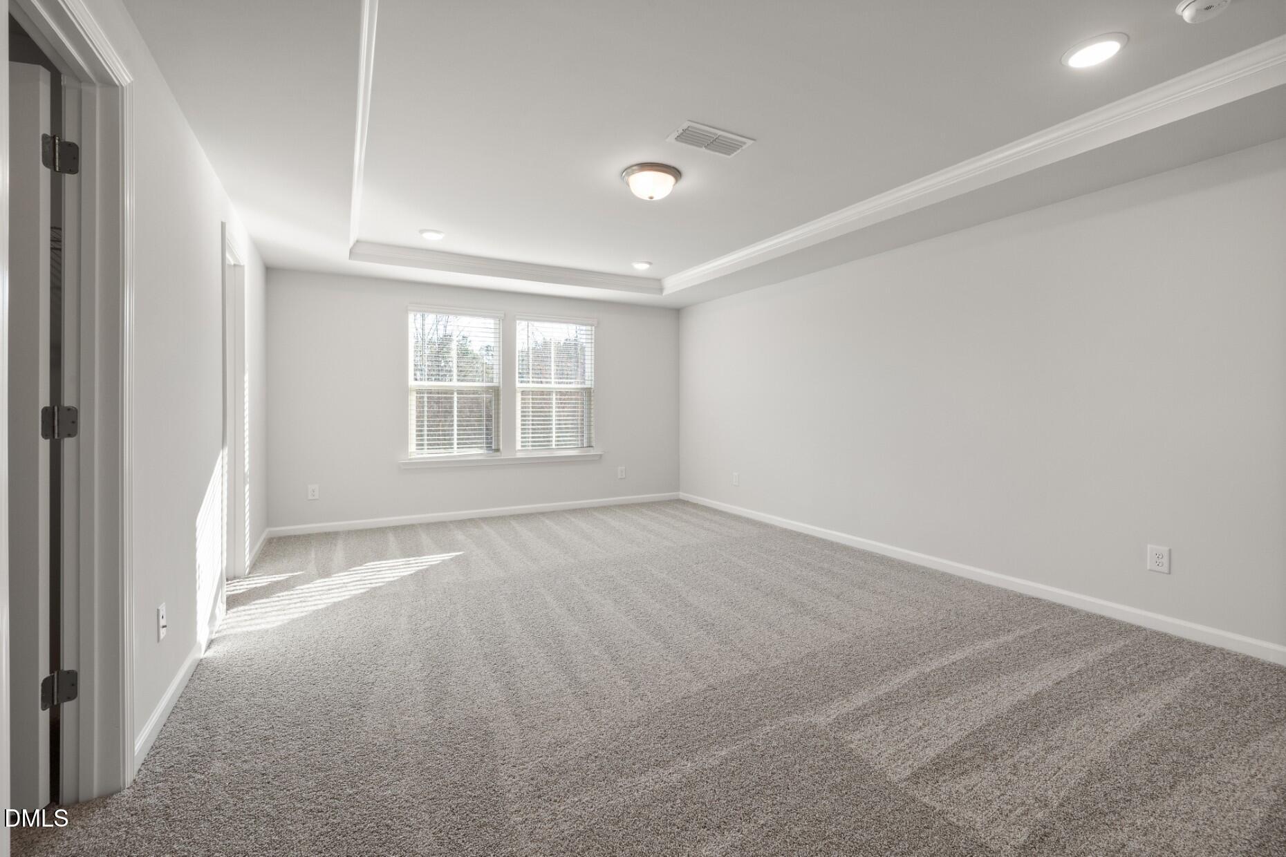 204 Armorial Court Willow Spring, NC 27592 - Photo 13 of 26 an empty room with windows