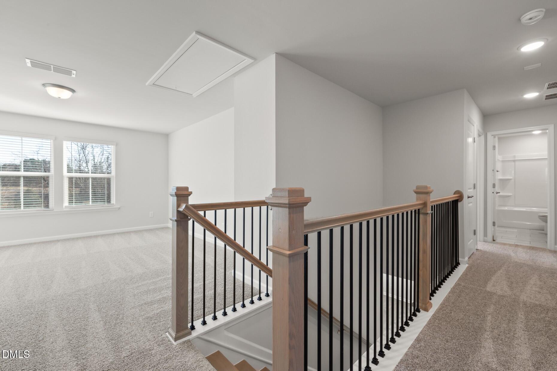 204 Armorial Court Willow Spring, NC 27592 - Photo 17 of 26 a view of a hallway with windows
