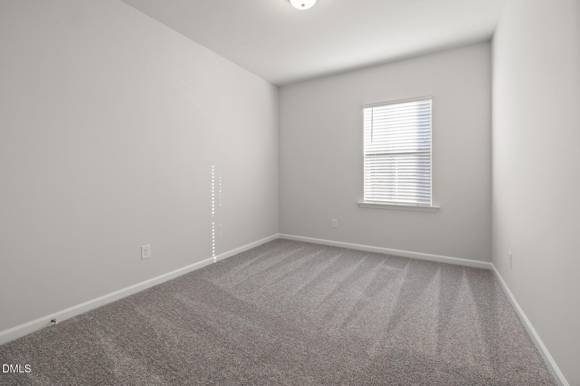 204 Armorial Court Willow Spring, NC 27592 - Photo 19 of 26 an empty room with a window