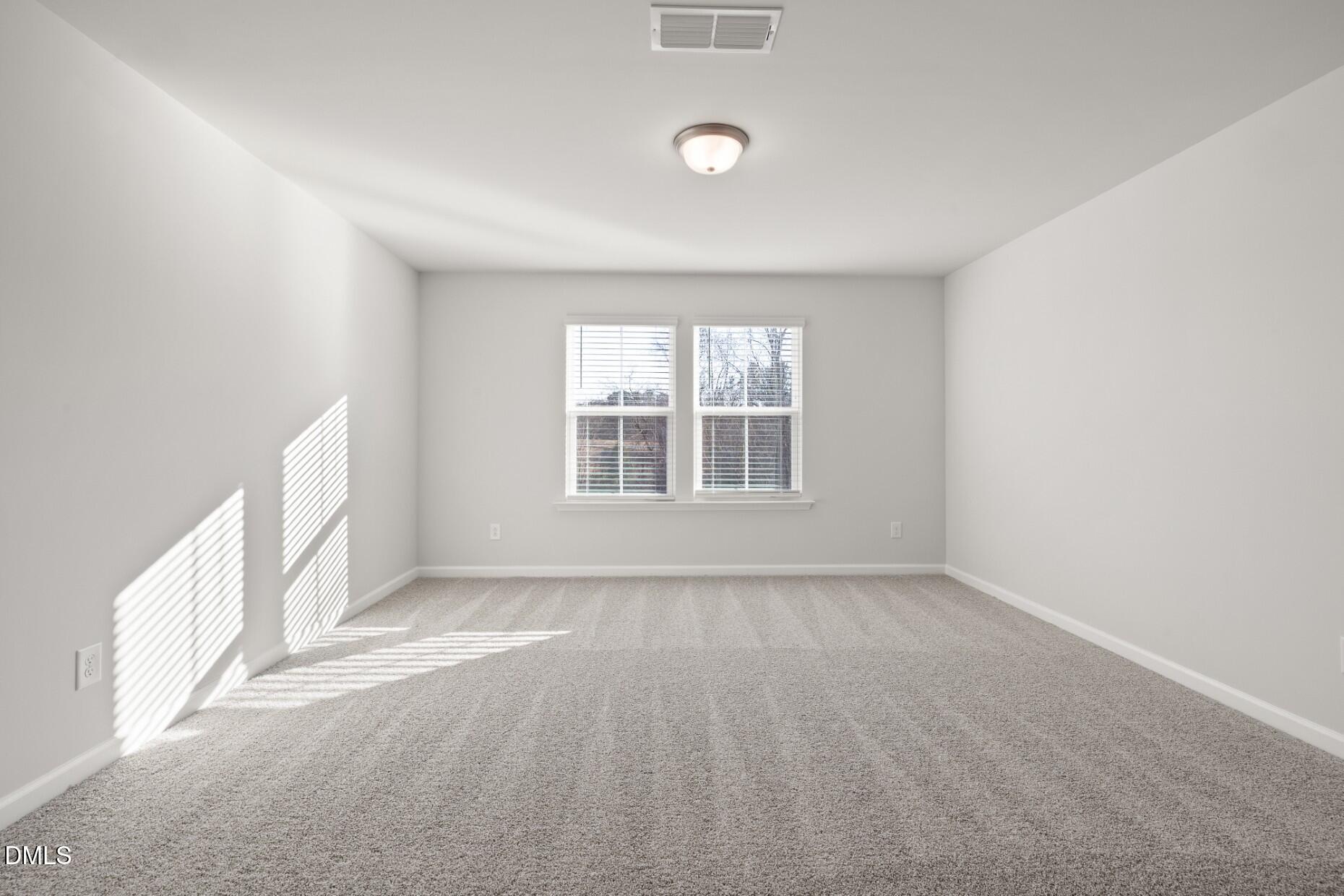 204 Armorial Court Willow Spring, NC 27592 - Photo 21 of 26 a view of an empty room with a window