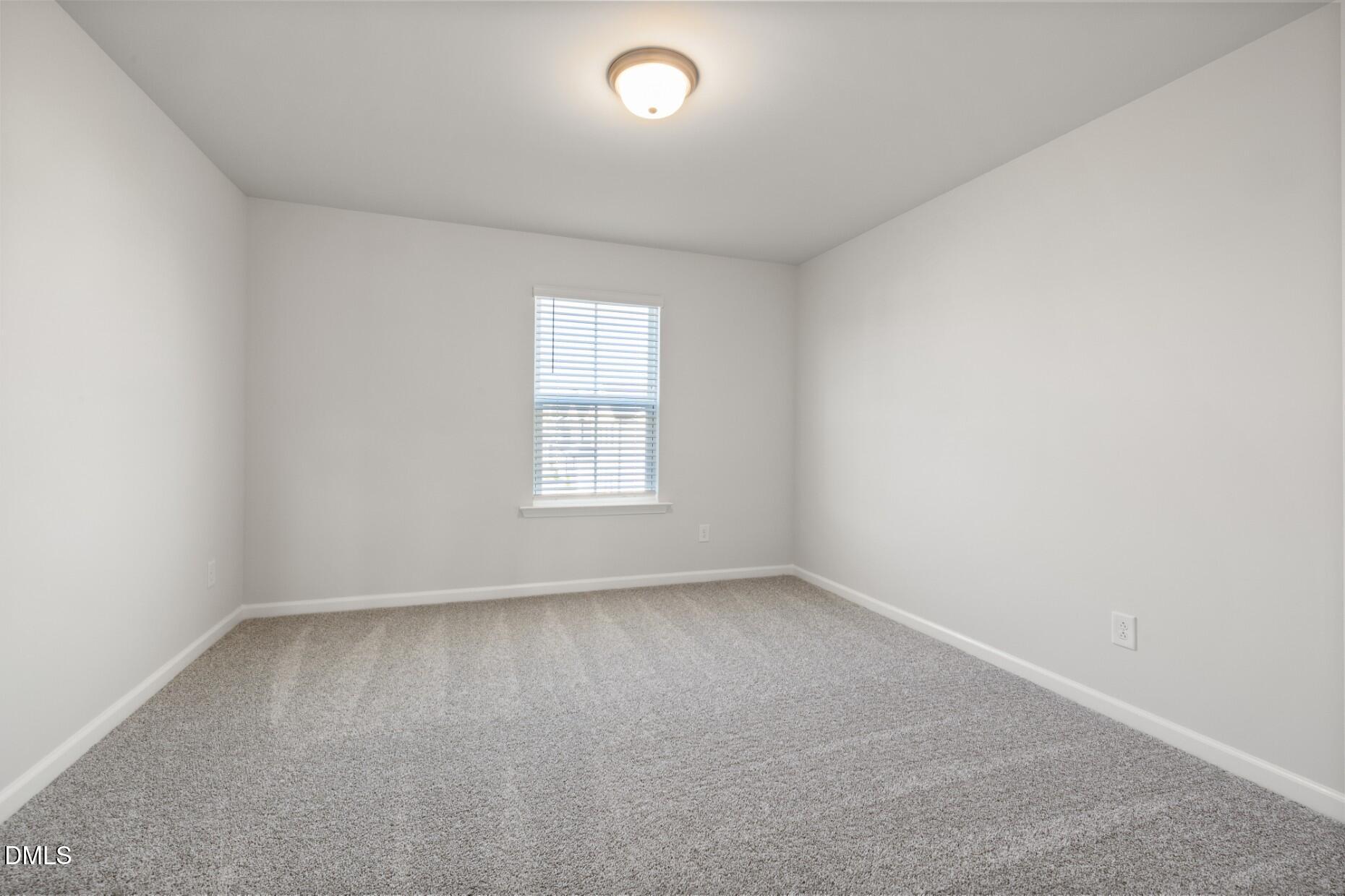 204 Armorial Court Willow Spring, NC 27592 - Photo 22 of 26 an empty room with a window