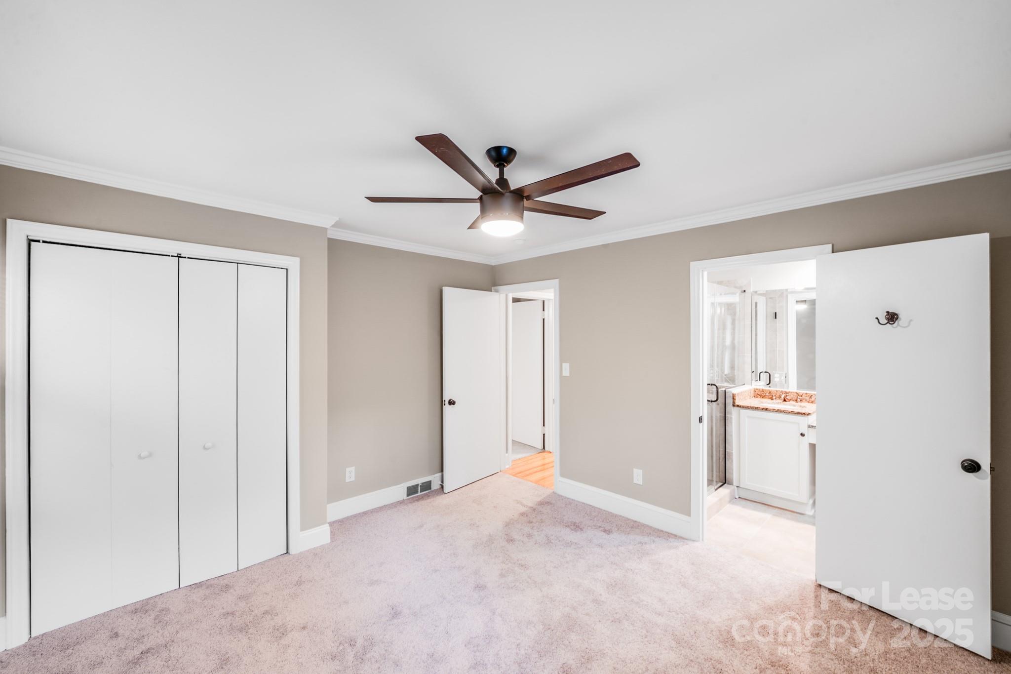 5600 Riviere Drive Charlotte, NC 28211 - Photo 21 of 35 a view of a livingroom with a ceiling fan