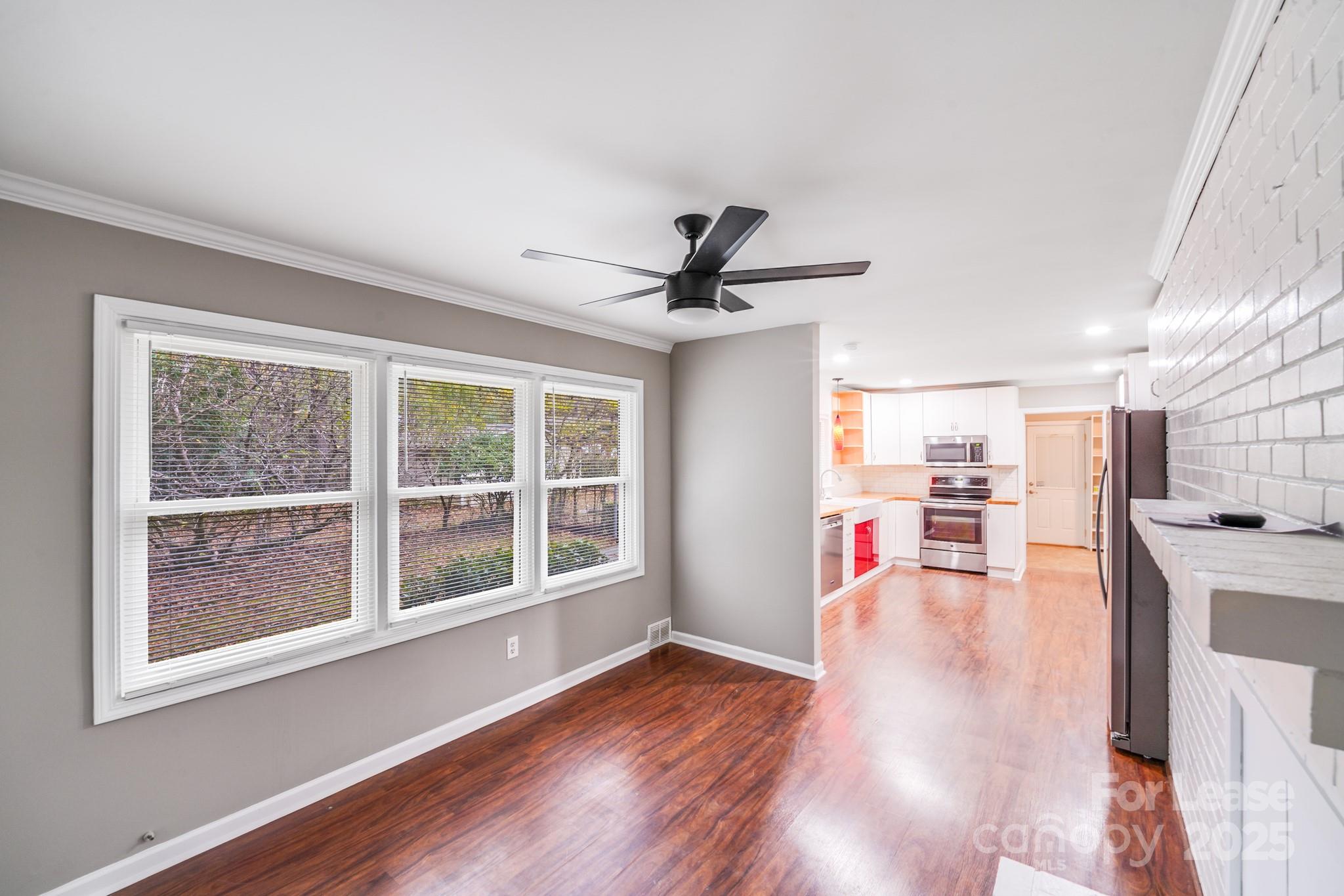 5600 Riviere Drive Charlotte, NC 28211 - Photo 25 of 35 a living room with furniture and a wooden floor