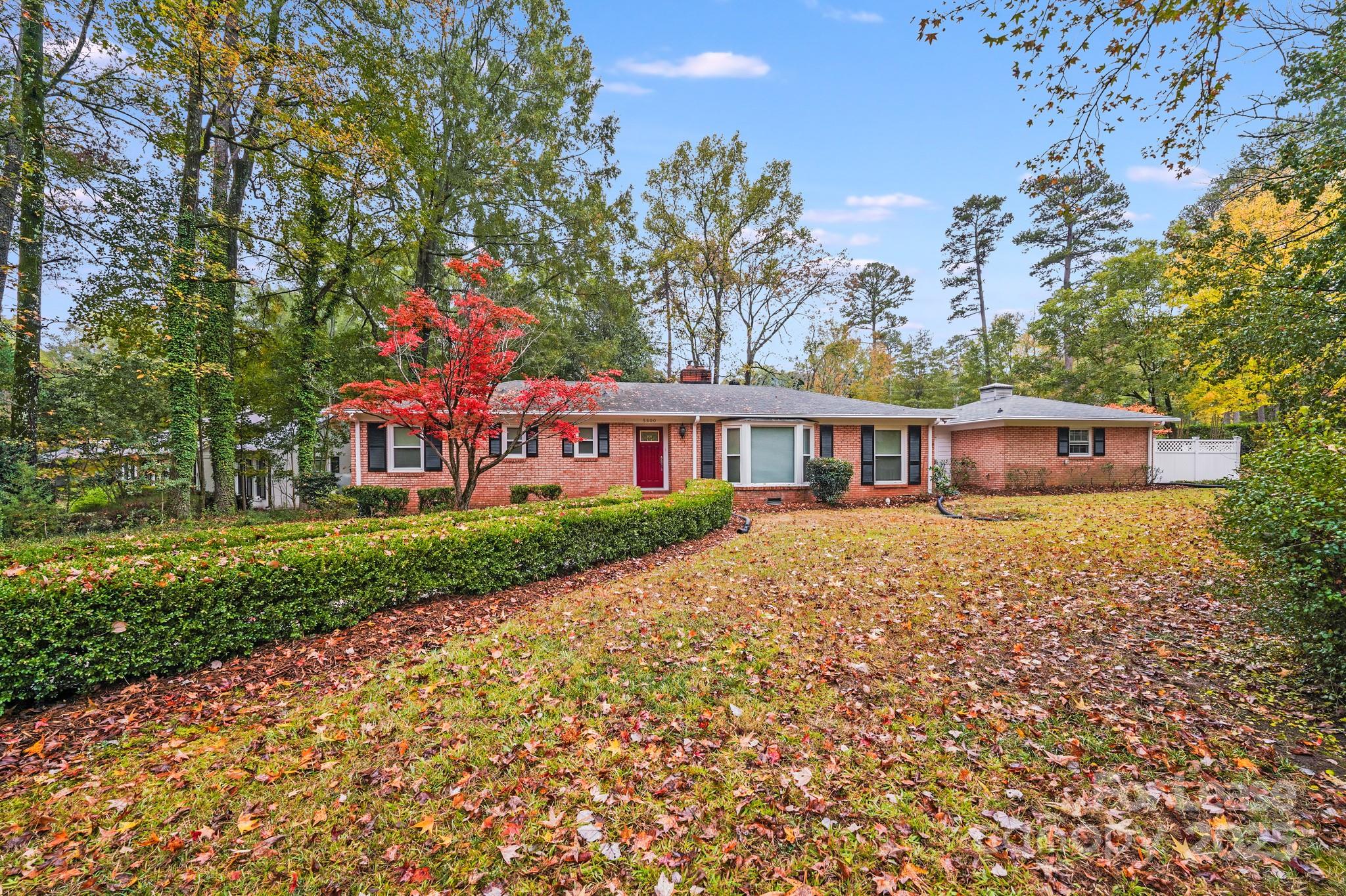 5600 Riviere Drive Charlotte, NC 28211 - Photo 30 of 35 a front view of a house with garden