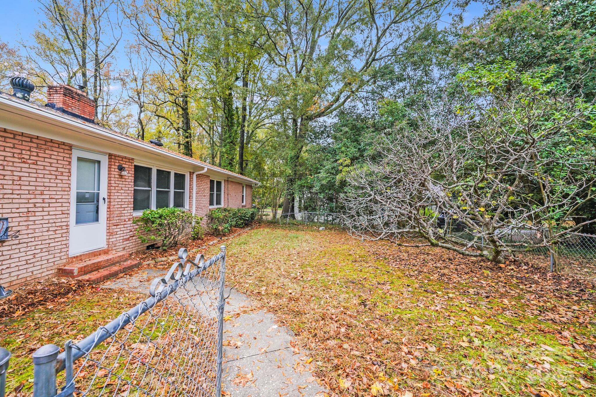5600 Riviere Drive Charlotte, NC 28211 - Photo 33 of 35 a view of a house with backyard and sitting area