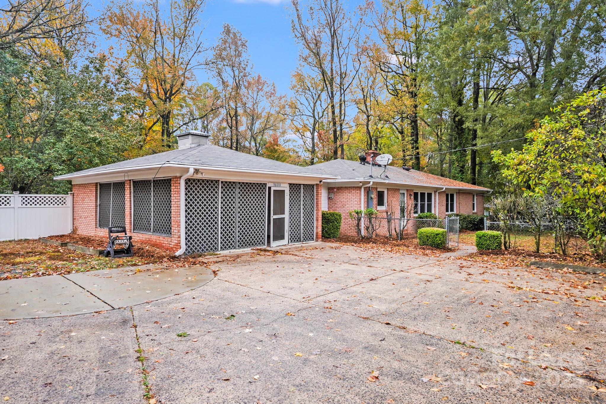 5600 Riviere Drive Charlotte, NC 28211 - Photo 34 of 35 a front view of a house with a garden