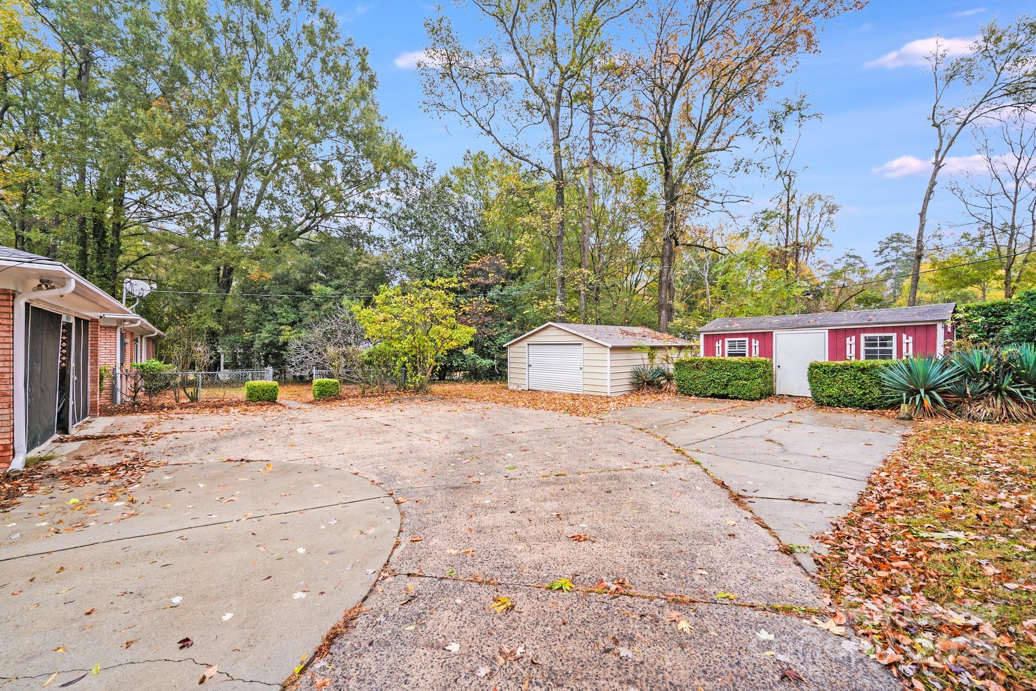 5600 Riviere Drive Charlotte, NC 28211 - Photo 35 of 35 a white house that has a tree in front of it