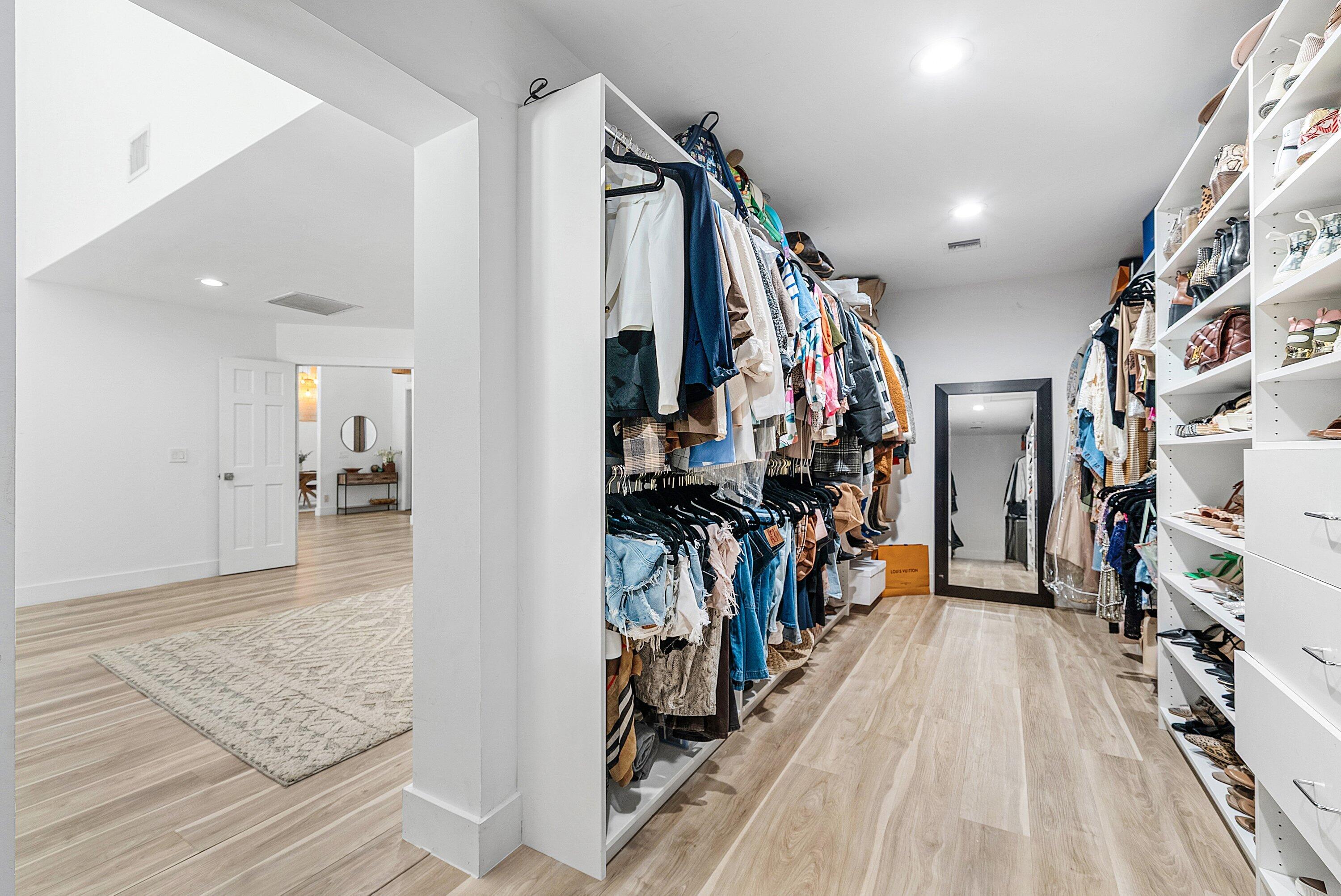 4408 Woodfield Boulevard Boca Raton, FL 33434 - Photo 28 of 53 a view of a hallway with wooden floor and windows