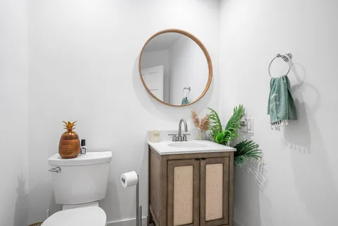 a work room with furniture and a flat screen tv