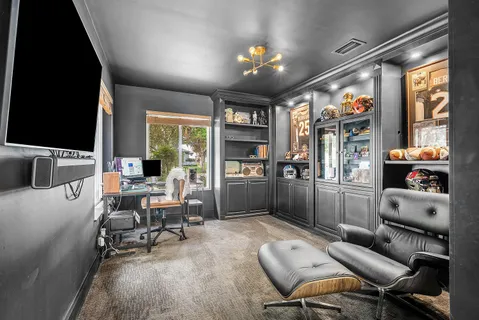 a bed room with two bed and a window