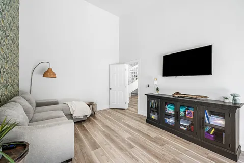 a view of a house with swimming pool and porch with furniture