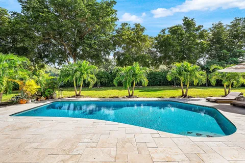 a view of a house with swimming pool