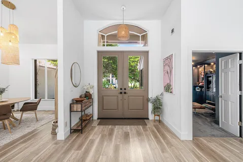 a view of a bedroom with furniture window and wooden floor