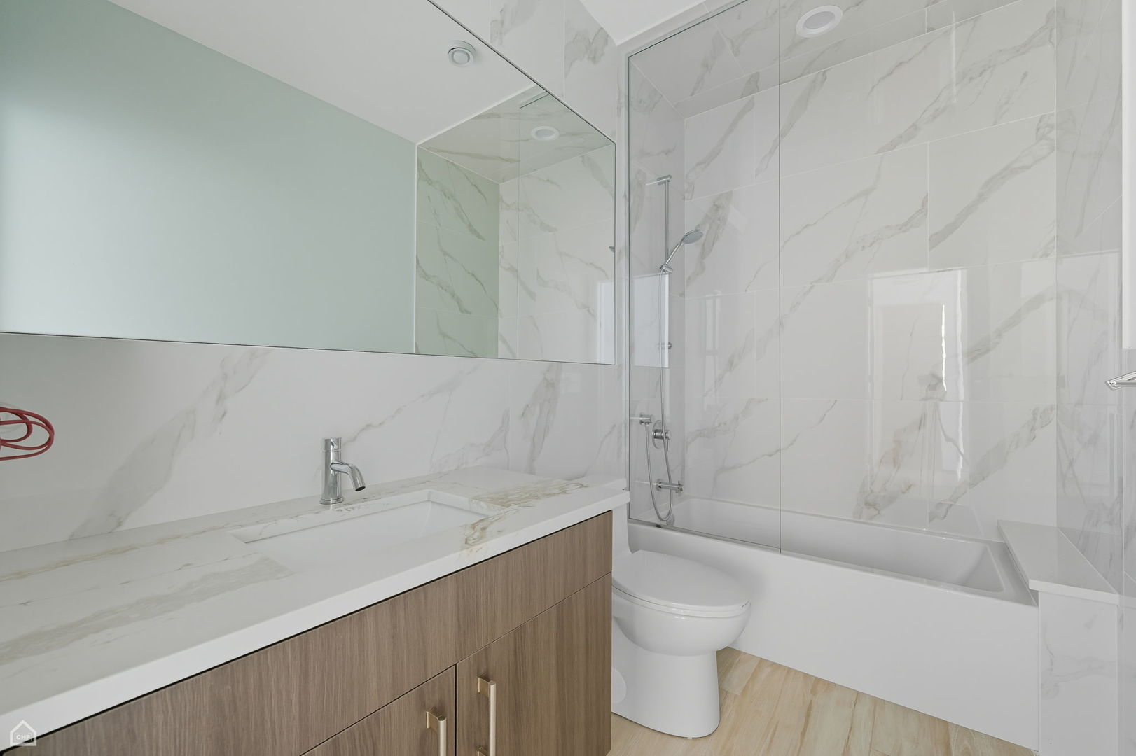 2354 North Washtenaw Avenue, Unit 301 Chicago, IL 60647 - Photo 9 of 16 a bathroom with a sink a toilet and shower