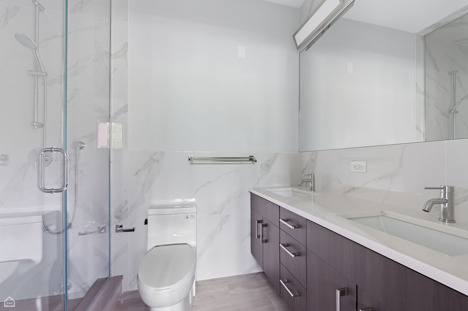 2354 North Washtenaw Avenue, Unit 301 Chicago, IL 60647 - Photo 10 of 16 a spacious bathroom with a sink toilet and shower