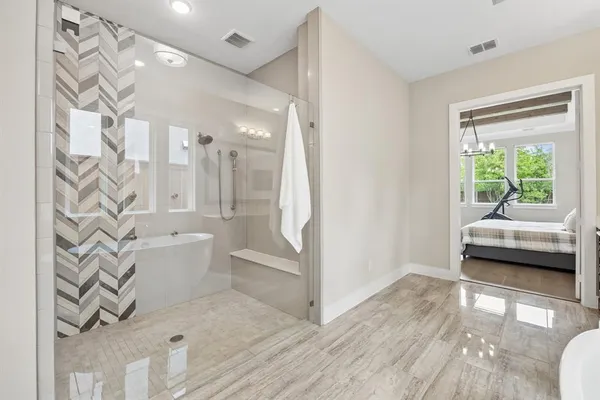 a bathroom with a bathtub and a shower