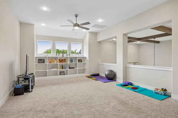 a room with gym equipment and a window