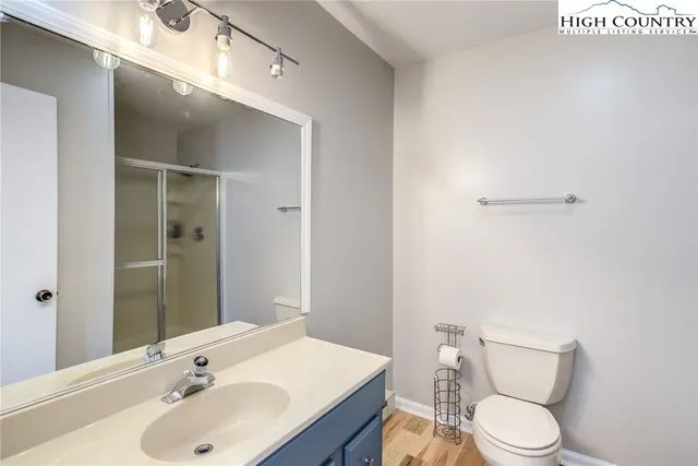 a bathroom with a glass shower door