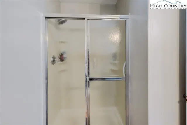 a bedroom with bed and a dresser