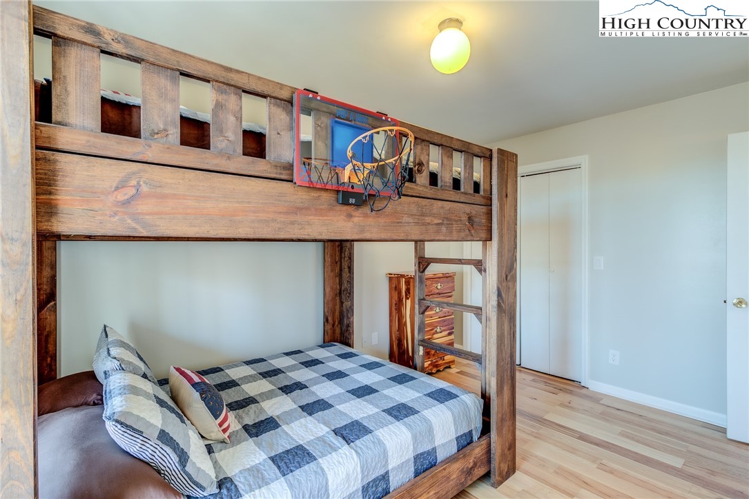 523 Pine Ridge Road Beech Mountain, NC 28604 - Photo 21 of 42 a bedroom with bed and a dresser