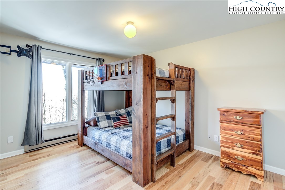 523 Pine Ridge Road Beech Mountain, NC 28604 - Photo 22 of 42 a room with furniture and a window